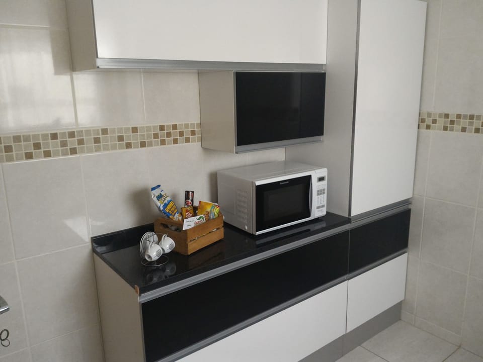 Family Apartment, Multiple Beds, Non Smoking | Private kitchen | Full-size fridge, microwave, oven, cookware/dishes/utensils