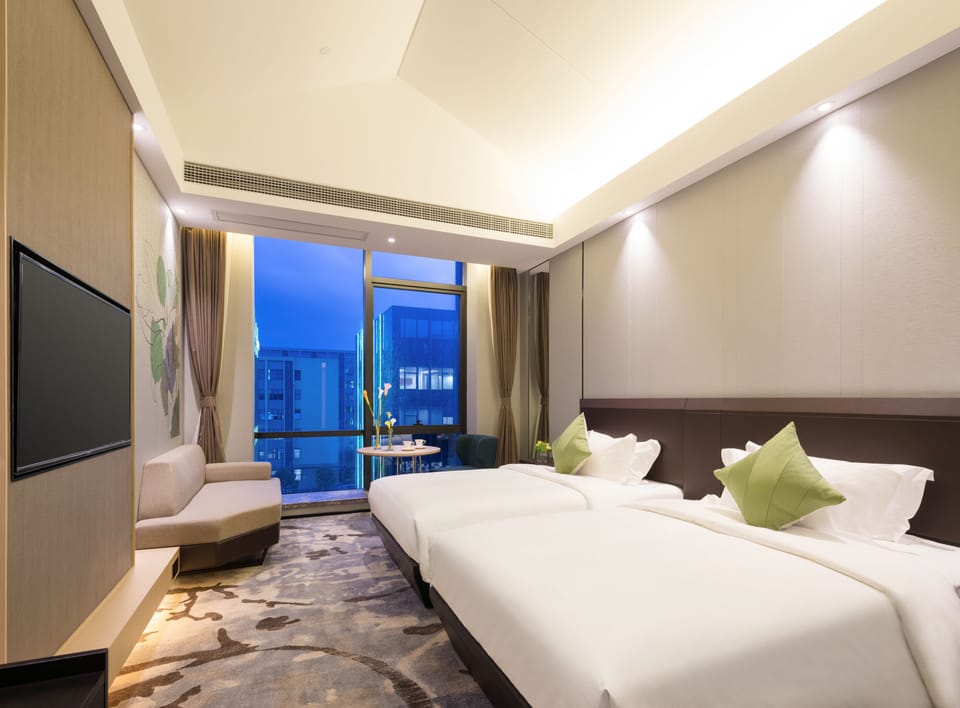 Premium bedding, down comforters, pillowtop beds, minibar