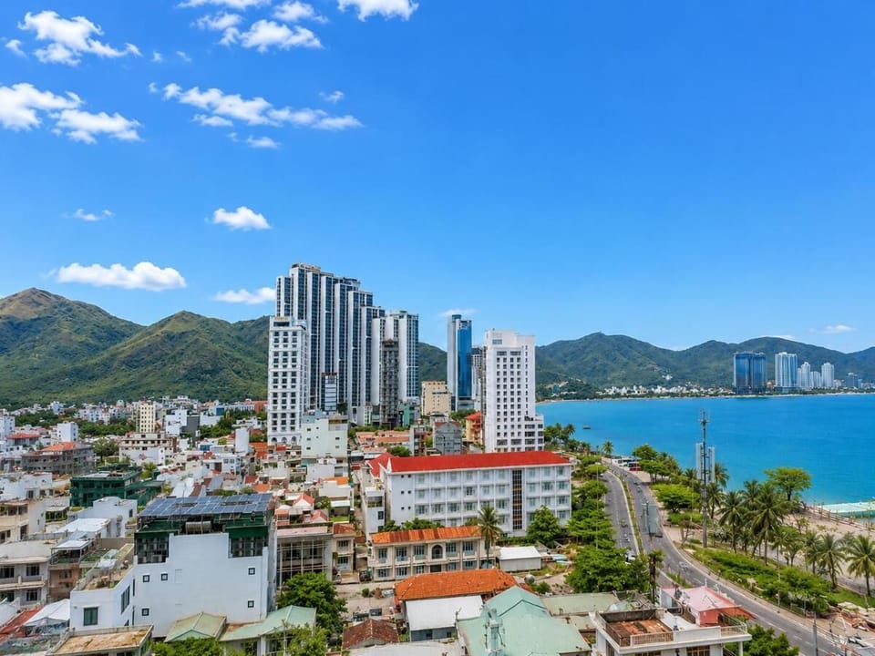 Deluxe Double Room, City View | Living area | 49-inch LCD TV with cable channels, TV