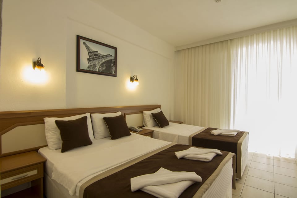 Standard Triple Room | Minibar, in-room safe, soundproofing, free cribs/infant beds