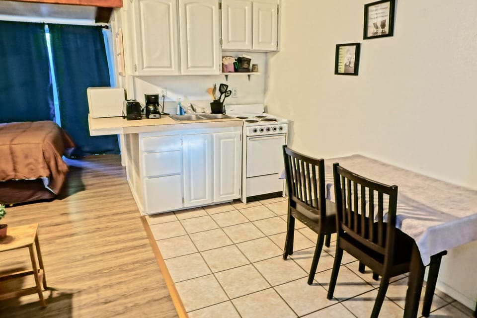 Romantic Bungalow, 1 King Bed, Kitchen | Private kitchen | Full-size fridge, microwave, coffee/tea maker, toaster