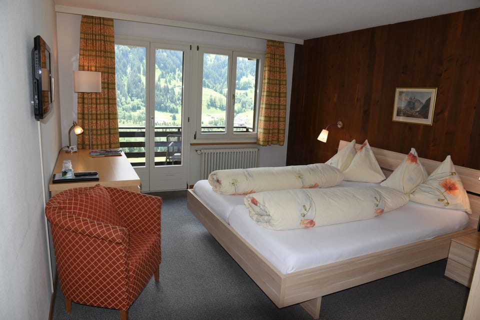 Panoramic Double Room, Balcony, Mountain View (Eiger) | Down comforters, individually decorated, individually furnished, desk
