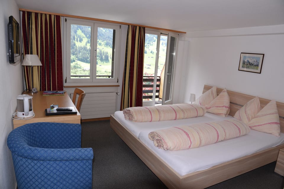 Panoramic Double Room, Balcony, Mountain View (Eiger) | Down comforters, individually decorated, individually furnished, desk