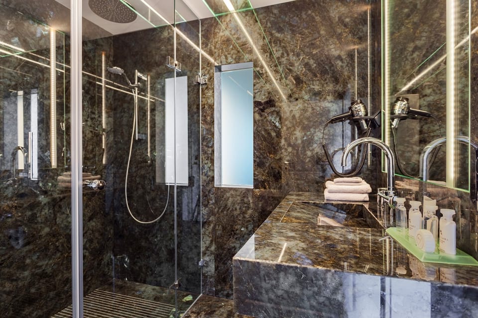 Gallery Suite, Jetted Tub, Mountain View | Bathroom | Hair dryer, bathrobes, slippers, towels