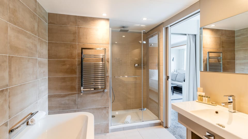 Eco-friendly toiletries, hair dryer, slippers, towels