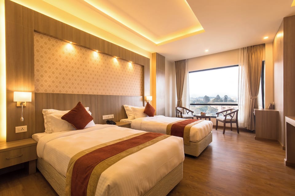 Deluxe Double or Twin Room | Minibar, desk, laptop workspace, soundproofing