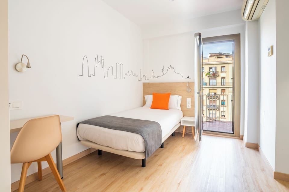 Single Room, Balcony, City View | Down comforters, individually decorated, individually furnished