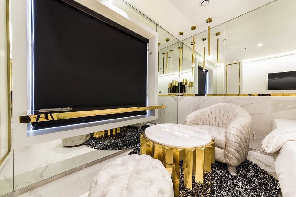 Deluxe Double Room | Living area | Flat-screen TV