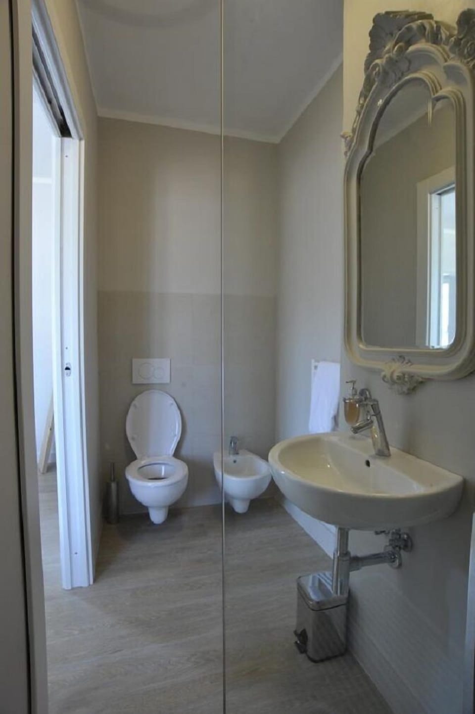 Shower, rainfall showerhead, bidet, towels