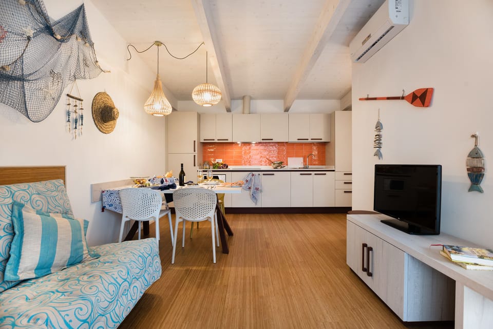 Standard Bungalow, Terrace, Garden View (Pino Nero) | Living room | Flat-screen TV, toys