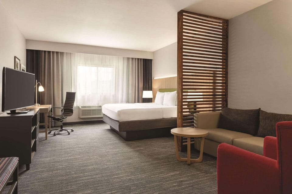 Desk, blackout drapes, soundproofing, iron/ironing board