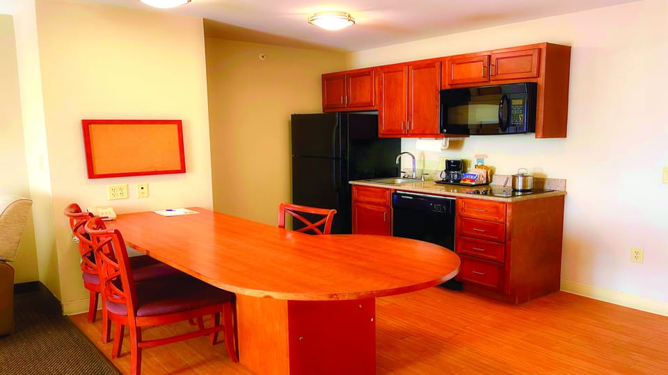 Suite, 1 Bedroom | Private kitchen | Full-size fridge, microwave, coffee/tea maker, cookware/dishes/utensils