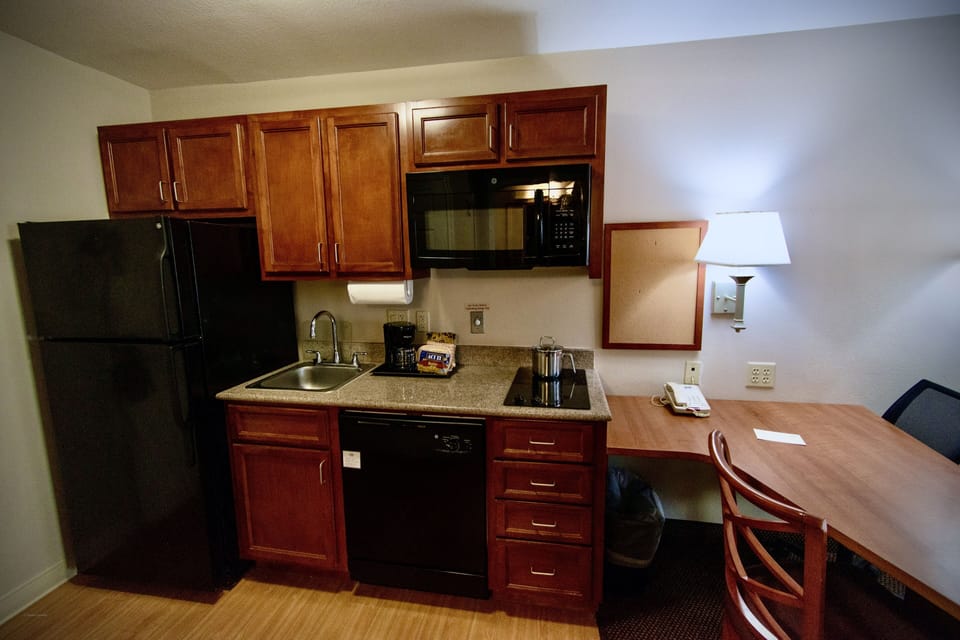 Full-size fridge, microwave, coffee/tea maker, cookware/dishes/utensils