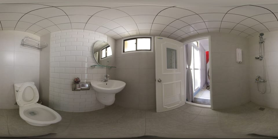 Shower, hair dryer, slippers, towels