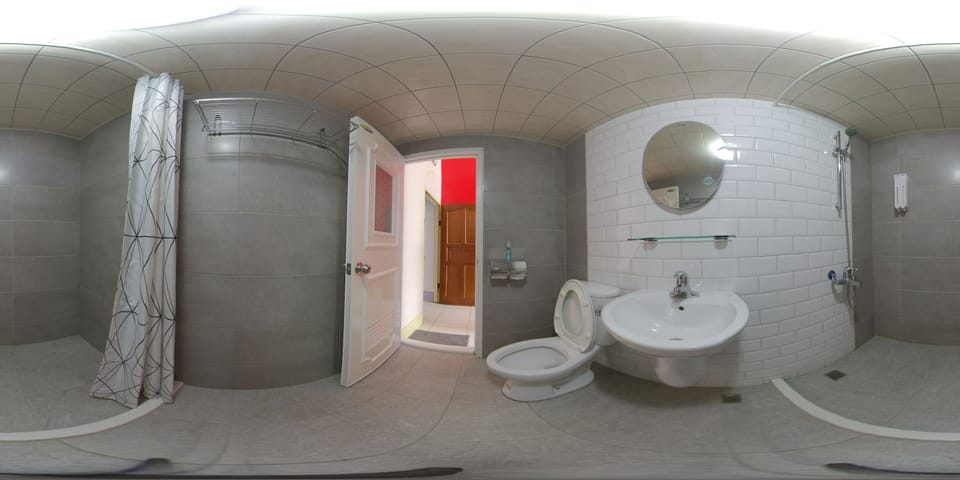 King Quadruple Room | Bathroom | Shower, hair dryer, slippers, towels
