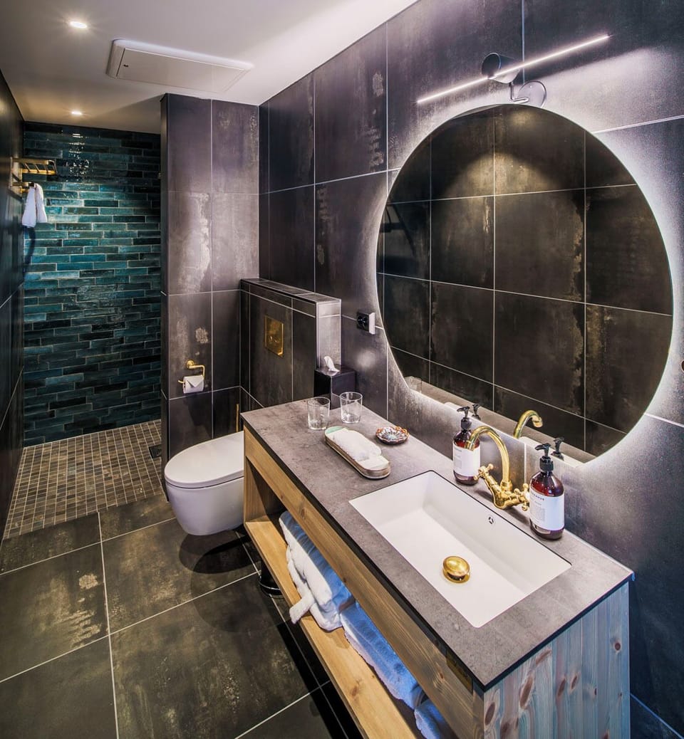 Shower, rainfall showerhead, designer toiletries, hair dryer