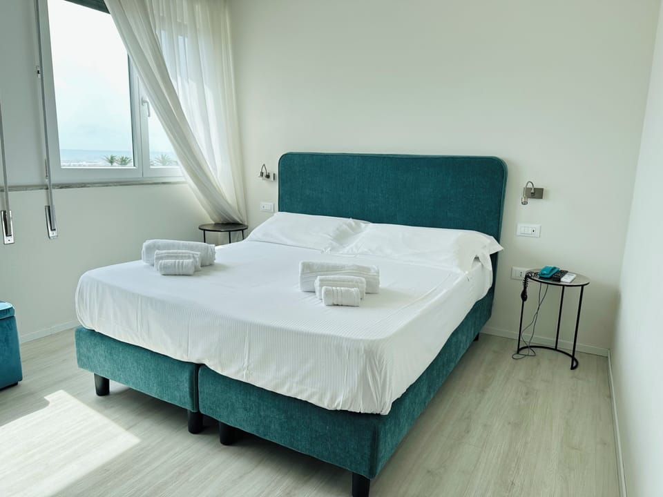 Deluxe Room, Sea View | In-room safe, desk, laptop workspace, soundproofing