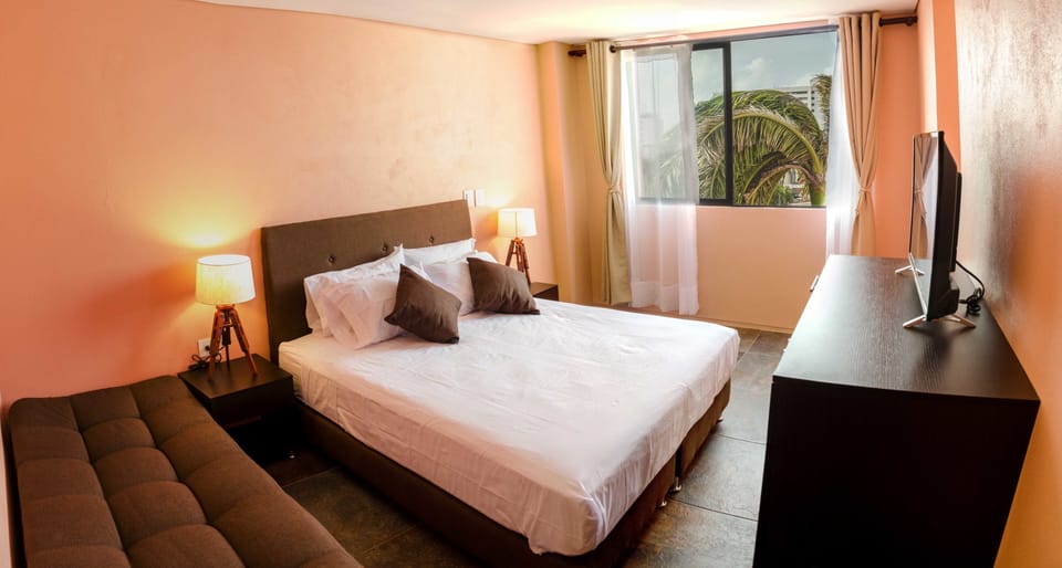 Standard Double Room, Multiple Beds | Minibar, in-room safe, blackout drapes, soundproofing