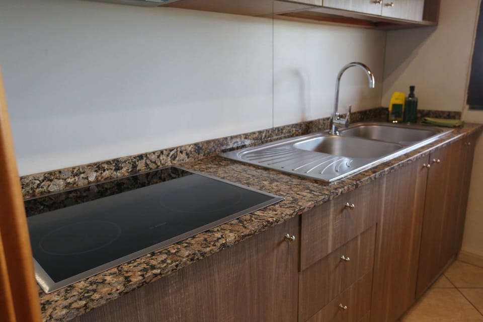 Standard Apartment, 1 Queen Bed, Non Smoking, Balcony | Private kitchenette | Coffee/tea maker, full-size fridge, microwave, oven