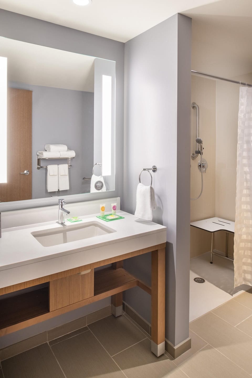 Designer toiletries, hair dryer, towels, soap