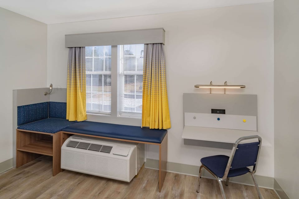 Desk, blackout drapes, iron/ironing board, free cribs/infant beds