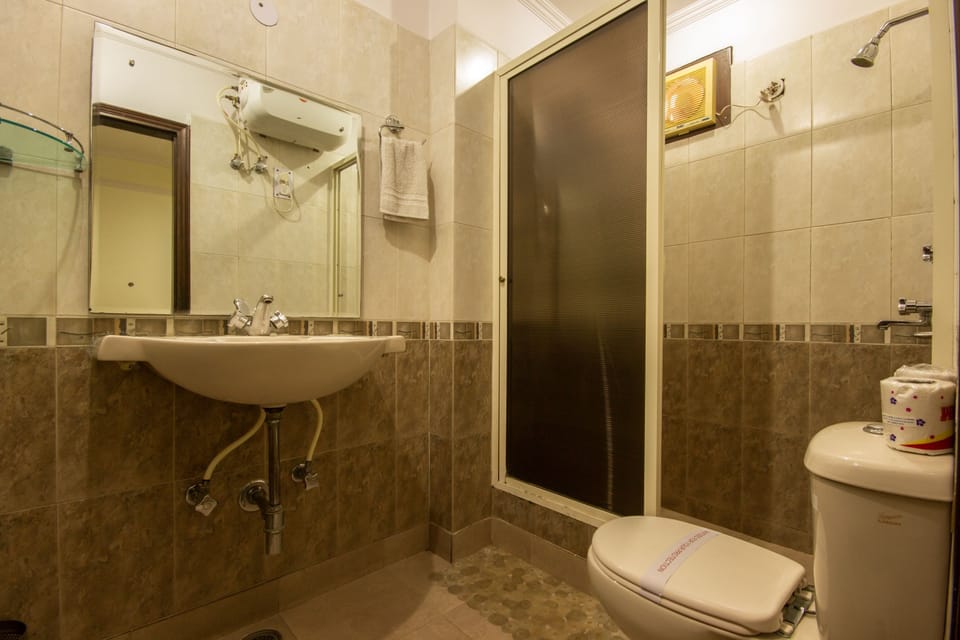 Shower, designer toiletries, hair dryer, slippers