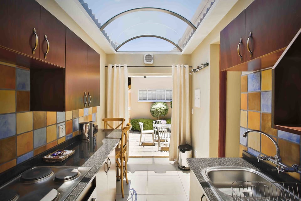 Junior Suite | Private kitchen | Full-size fridge, microwave, oven, stovetop