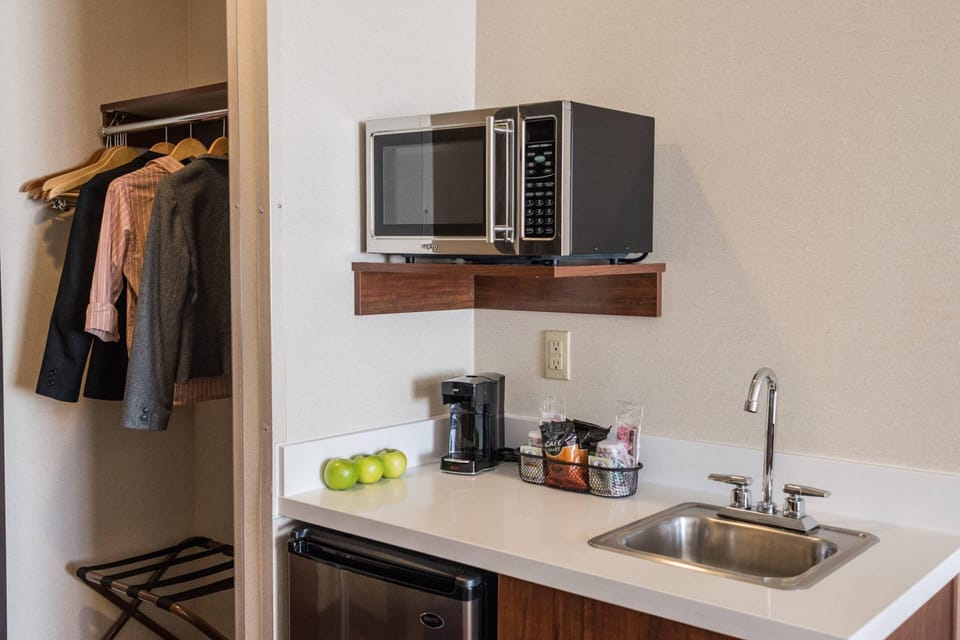 Desk, laptop workspace, blackout drapes, iron/ironing board