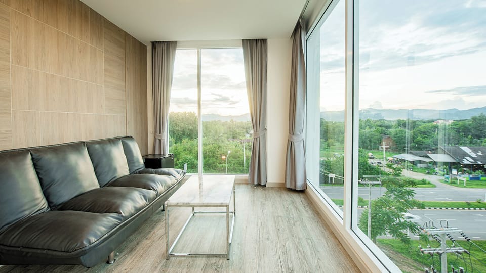 Junior Suite Room | Living area | 32-inch LCD TV with cable channels