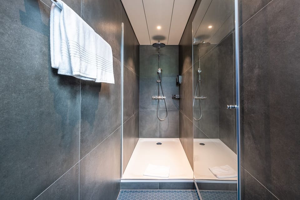 Junior Suite, City View (Design) | Bathroom | Hair dryer, bathrobes, slippers, towels