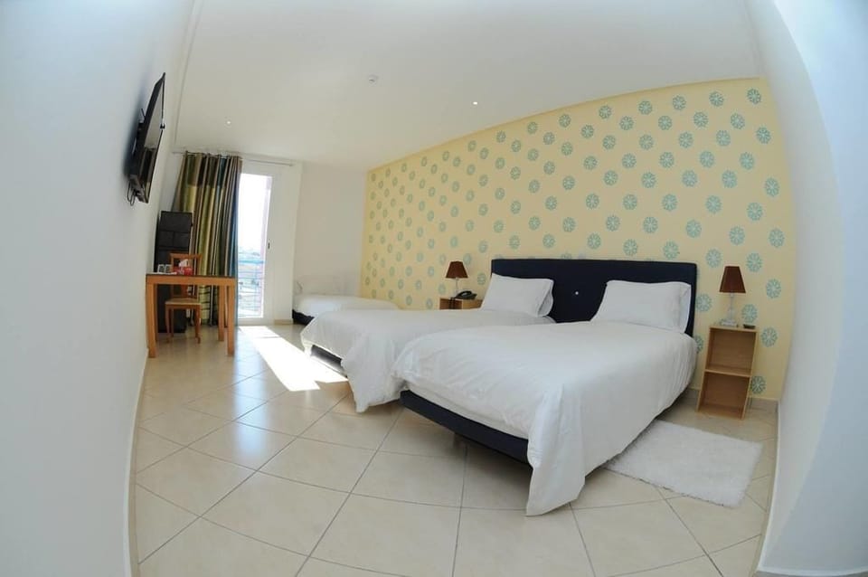 Comfort Triple Room | Minibar, desk, blackout drapes, iron/ironing board