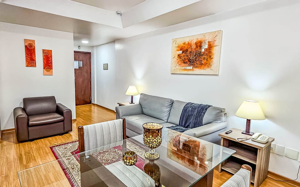 Deluxe Double Room | Living area | LCD TV