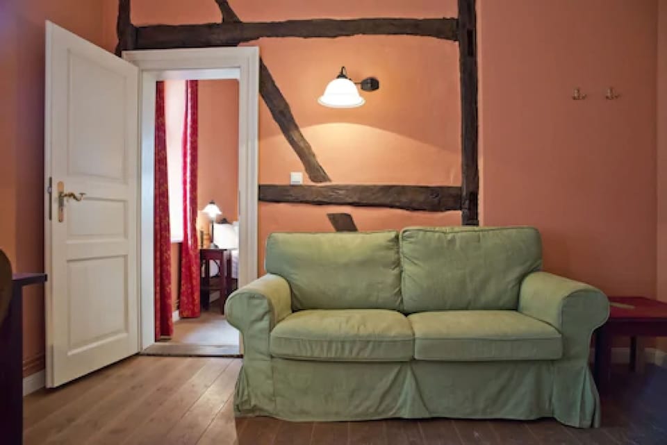 Double Room, Ground Floor (Zinnenhaus) | Living area | Table tennis, books