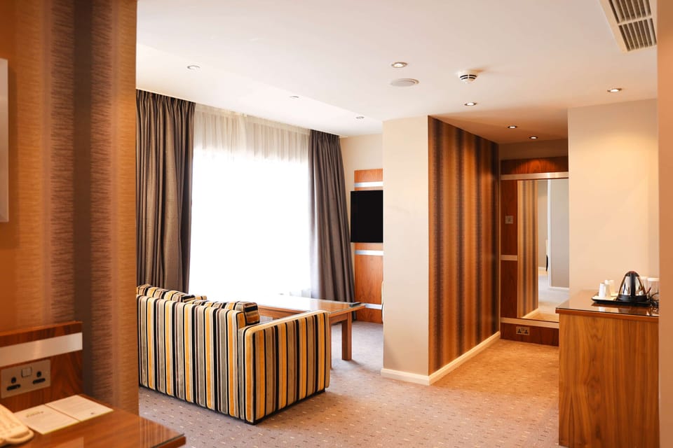 Apartment | Living area | 55-inch LCD TV with satellite channels