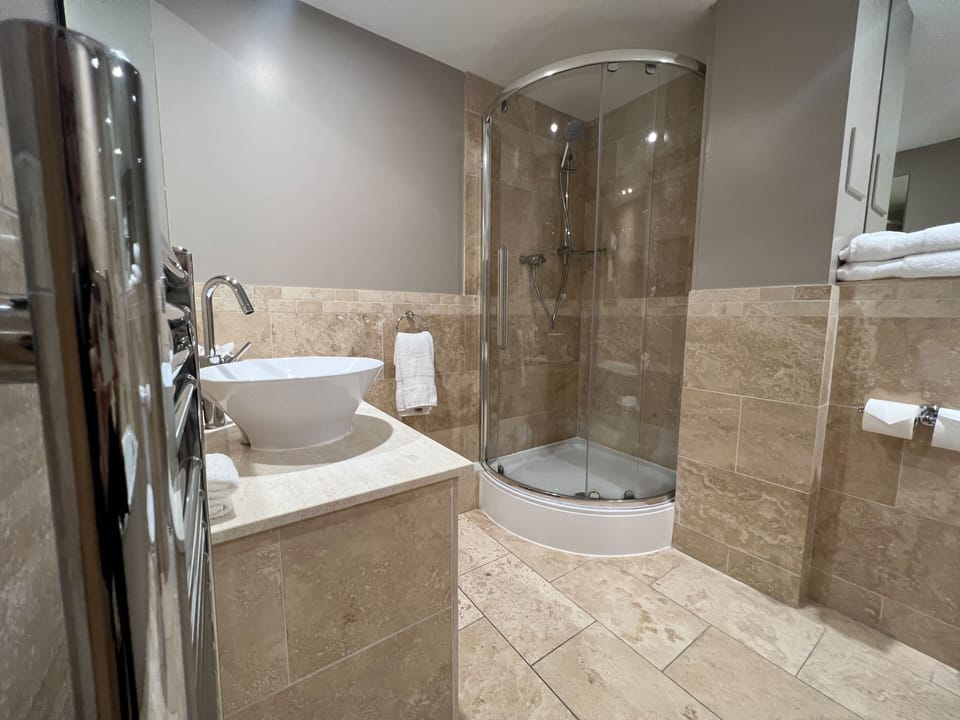 Family Room, 1 King Bed (Daytime Pitch View) | Bathroom | Designer toiletries, hair dryer, towels, soap