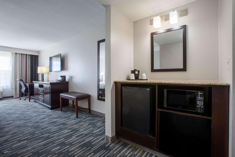 Suite, 1 King Bed, Non Smoking, Jetted Tub | Desk, laptop workspace, blackout drapes, iron/ironing board