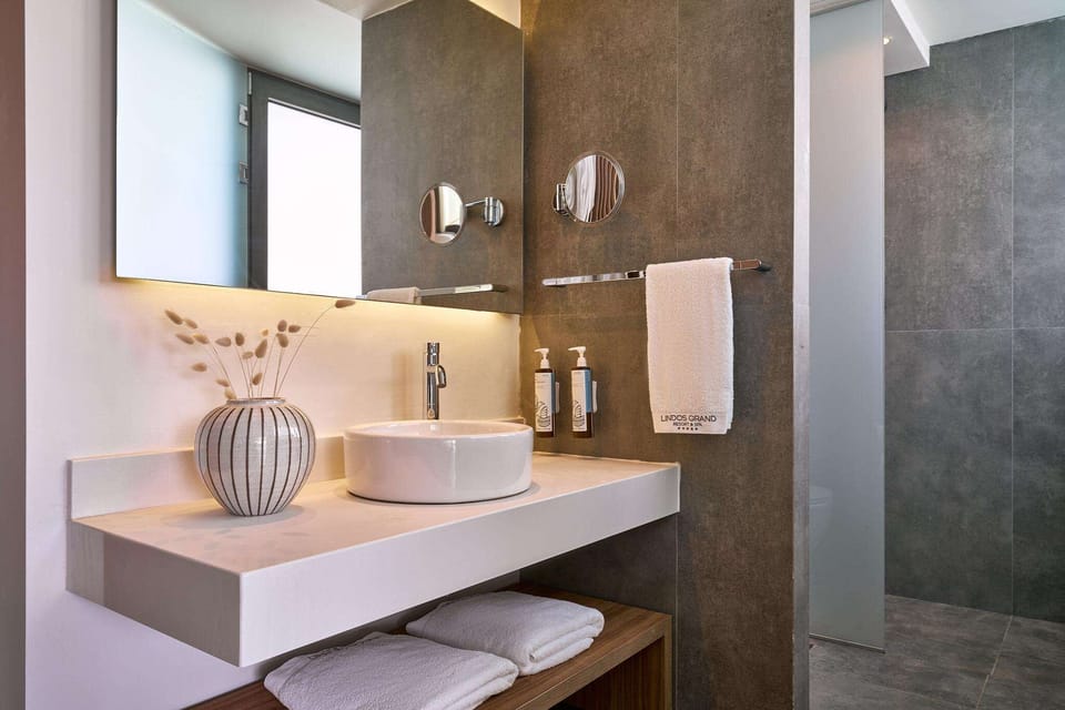 Shower, eco-friendly toiletries, hair dryer, bathrobes