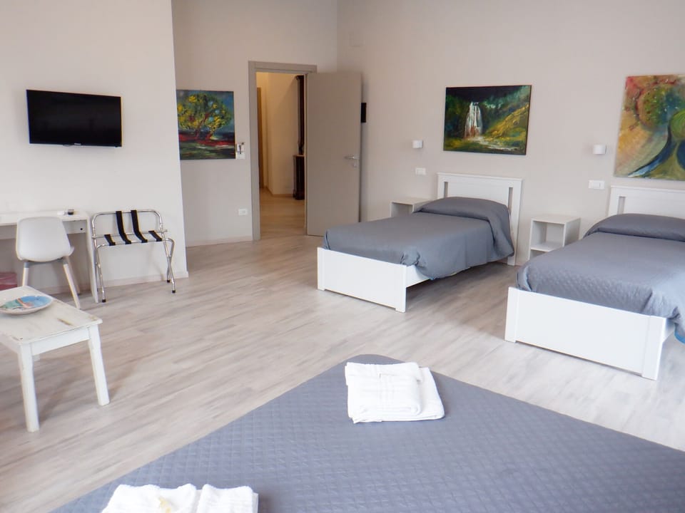 Deluxe Quadruple Room, Ensuite | Down comforters, memory foam beds, desk, laptop workspace