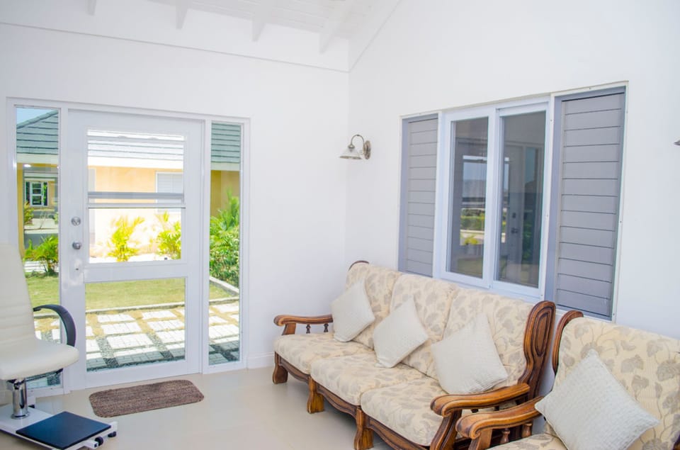 Family Villa | Living room | 50-inch flat-screen TV with cable channels, TV, DVD player