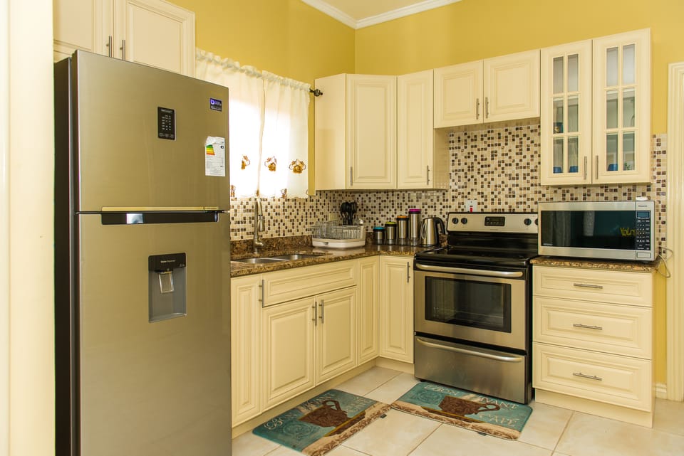 Luxury Apartment, Pool View | Private kitchen | Full-size fridge, microwave, oven, stovetop