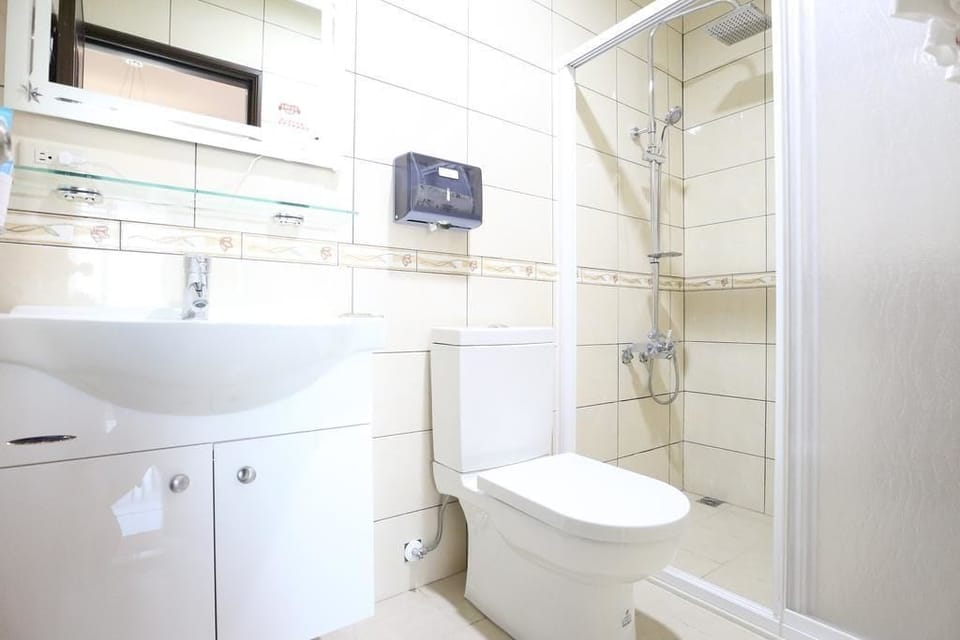 Signature Quadruple Room, 2 Double Beds, Non Smoking | Bathroom | Shower, hair dryer, slippers, towels