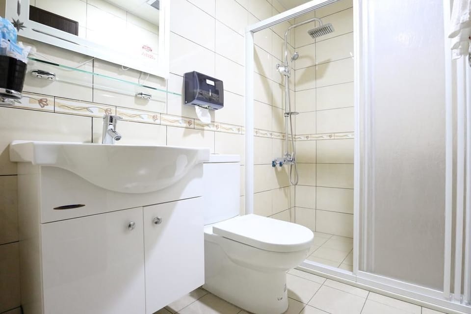 Standard Quadruple Room, 2 Double Beds, Non Smoking | Bathroom | Shower, hair dryer, slippers, towels