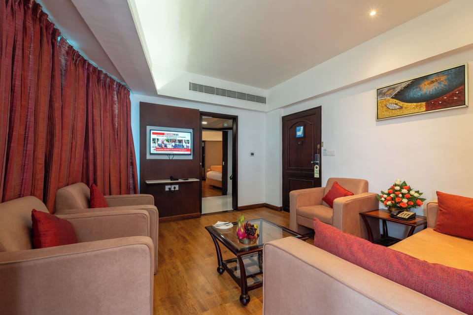 Presidential Suite, 1 King Bed | Living area | 32-inch LCD TV with satellite channels, TV