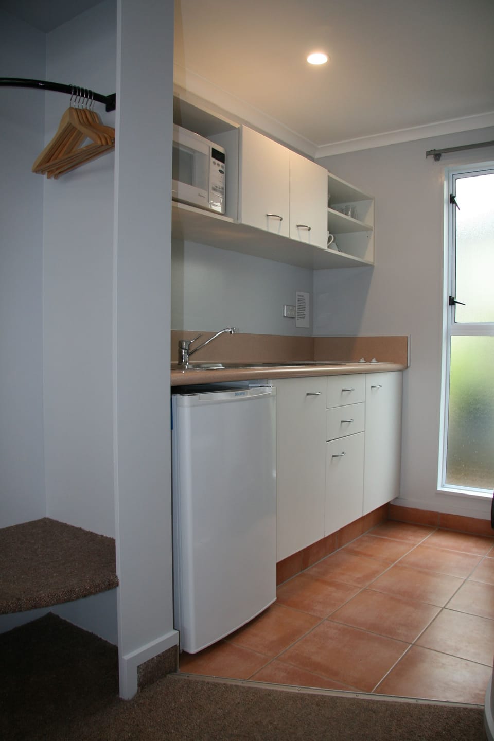 Fridge, microwave, stovetop, coffee/tea maker