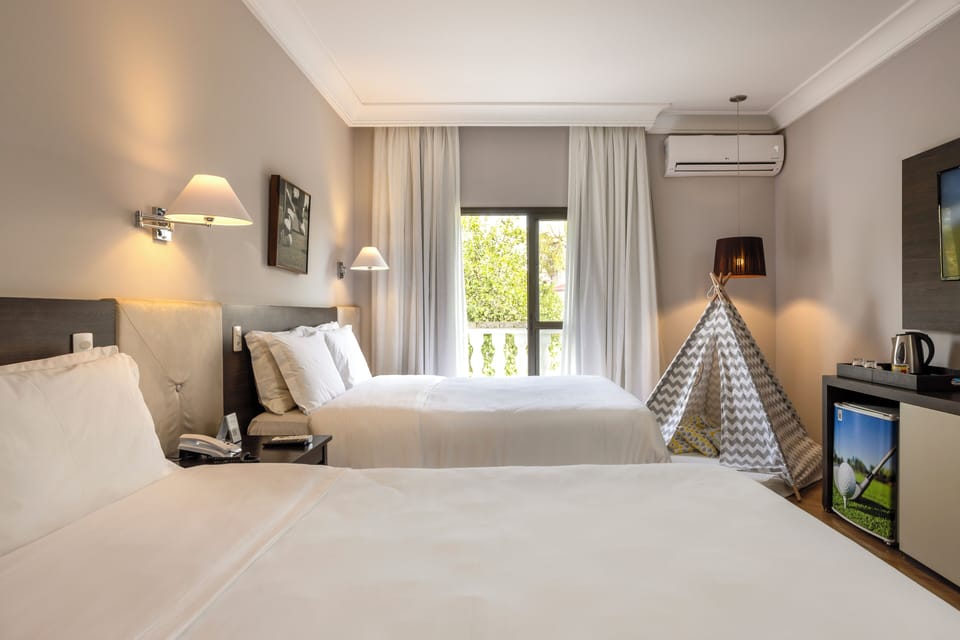 Family Room, 2 Double Beds | Hypo-allergenic bedding, minibar, in-room safe, desk