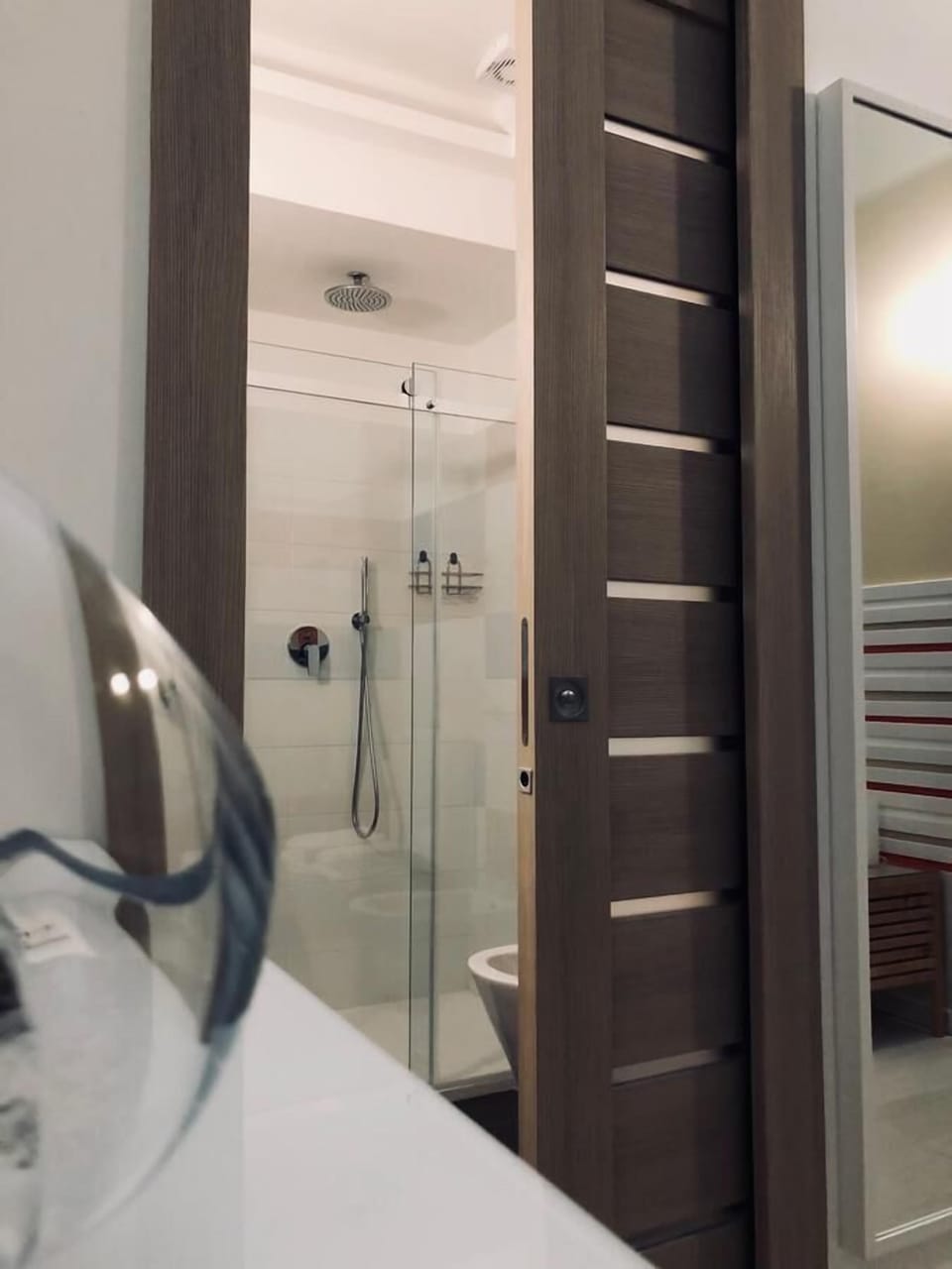Shower, rainfall showerhead, designer toiletries, hair dryer
