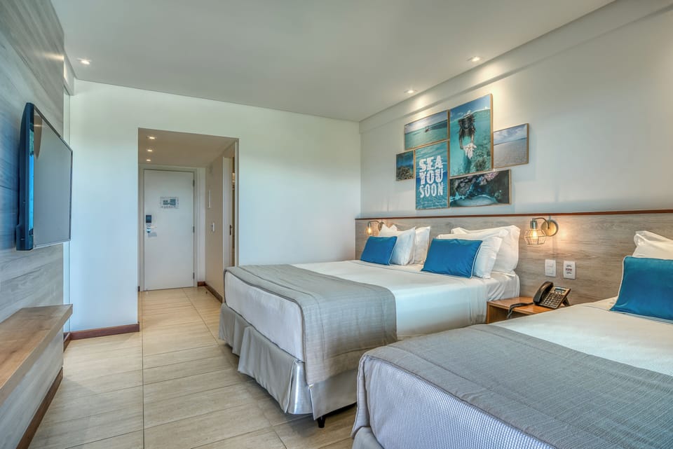 Standard Room | Minibar, in-room safe, individually decorated, desk