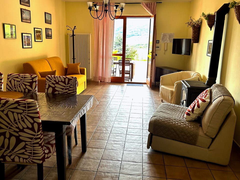 Superior Apartment, 1 Queen Bed with Sofa bed, Partial Lake View | Living area | Flat-screen TV