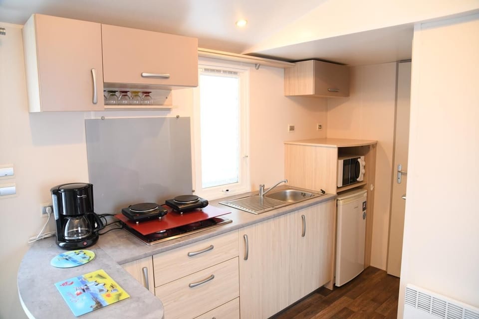 Fridge, microwave, stovetop, coffee/tea maker