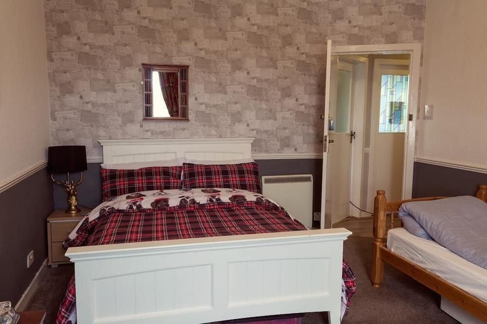 Family Room, Shared Bathroom | Desk, blackout drapes, iron/ironing board, free WiFi